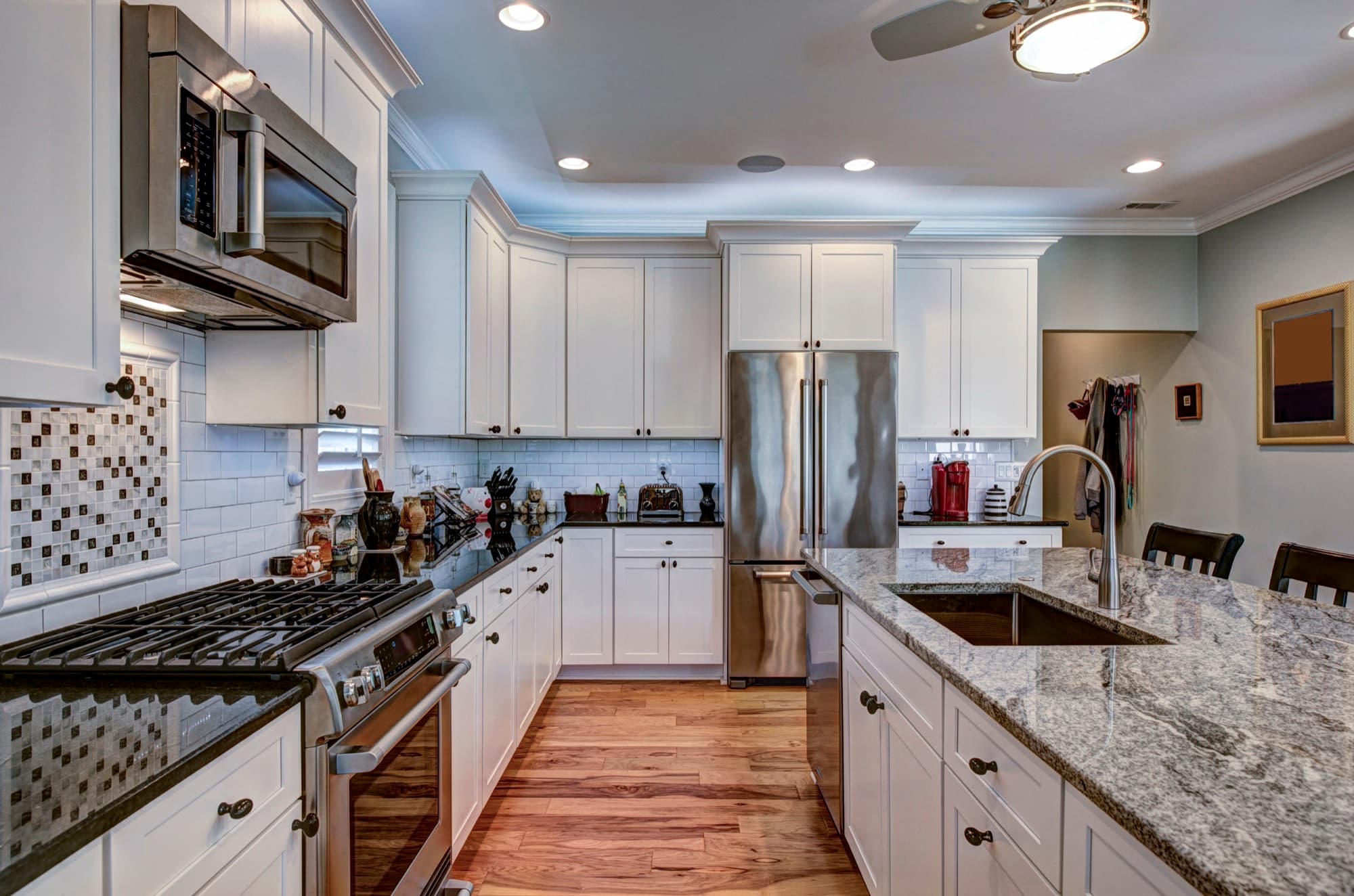 High-end kitchen with granite worktops and fitted cabinetry